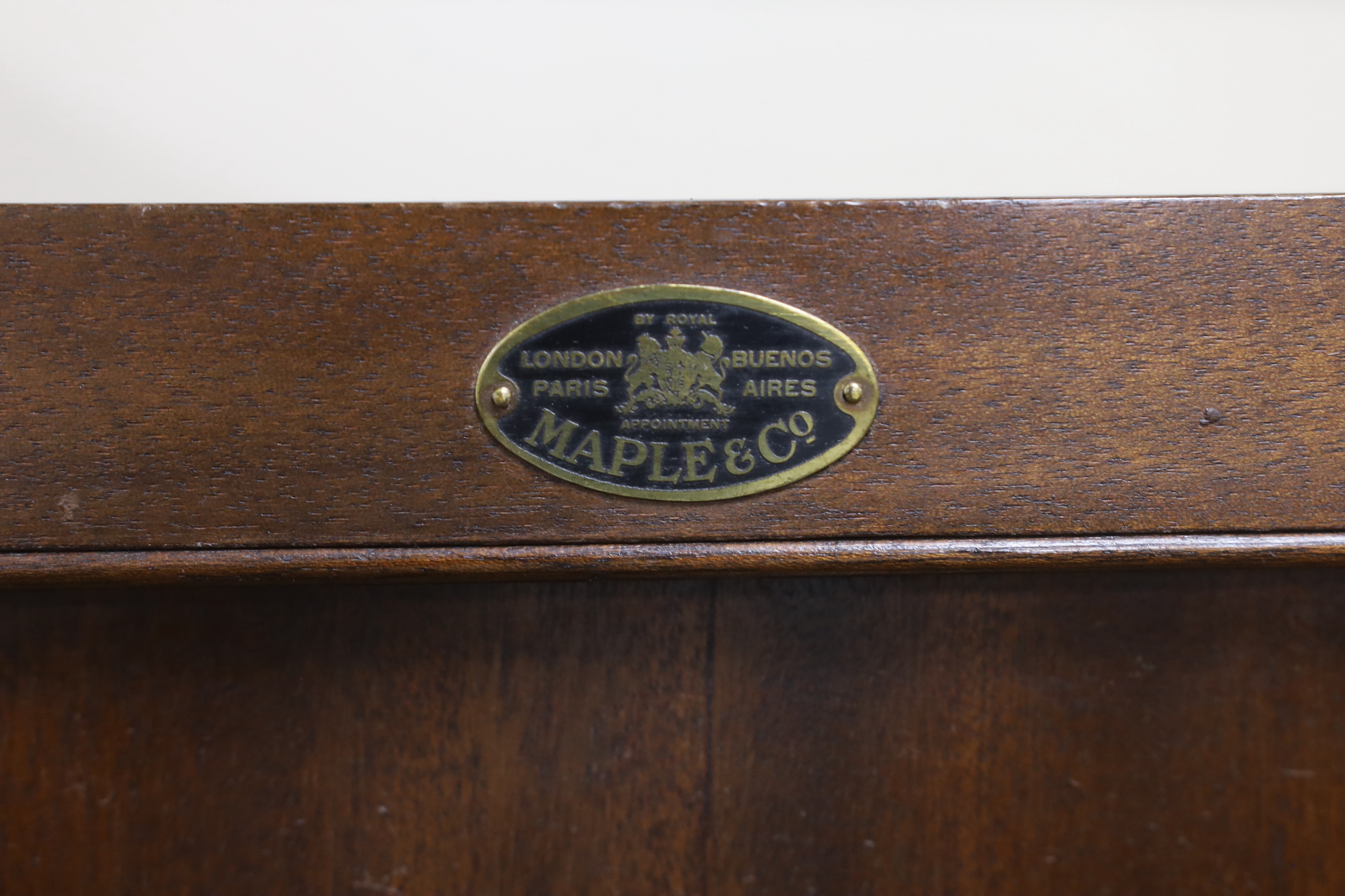An early 20th century Maple & Co. mahogany narrow press cupboard, width 80cm, depth 45cm, height 168cm